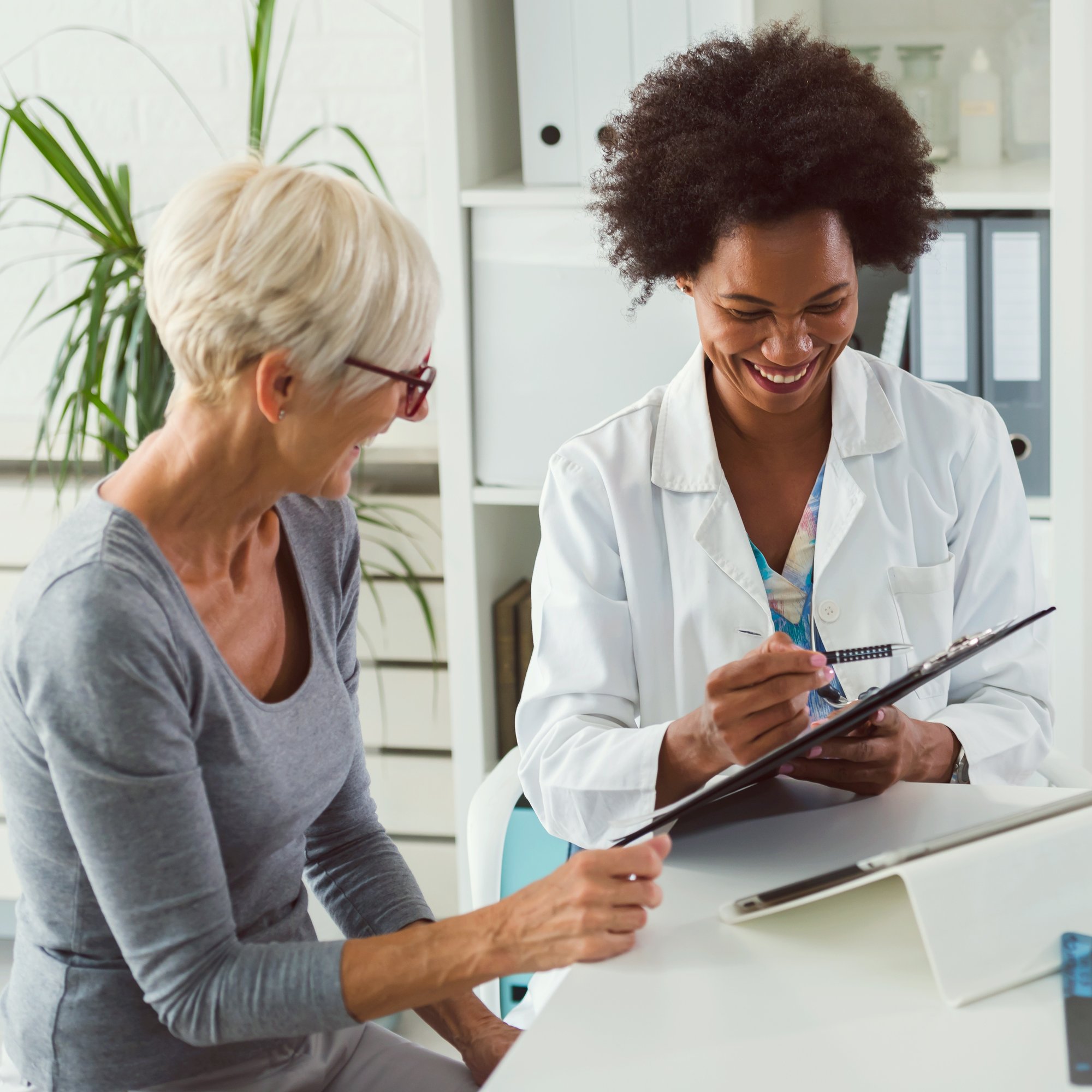 Young black female provider and older female patient